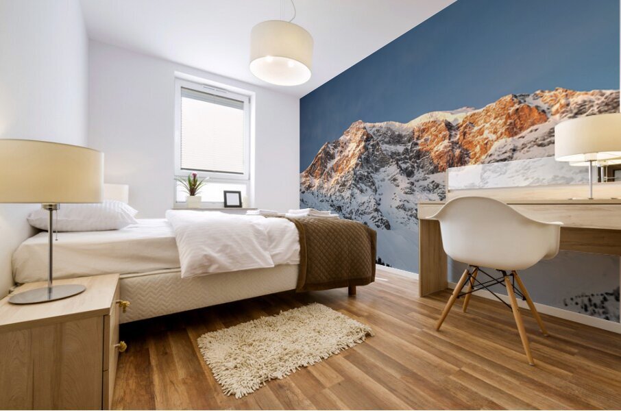 Orange light of the sunrise reaching the top of the Ortler Mountain in South Tyrol  Mural print