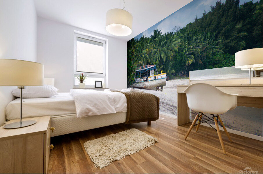 Fishing ship boat stranded on white sand beach Mural print