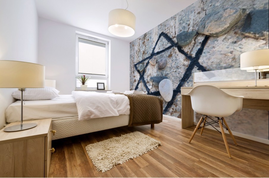 A star of david etched and painted on a rock with stones laying on it Mural print