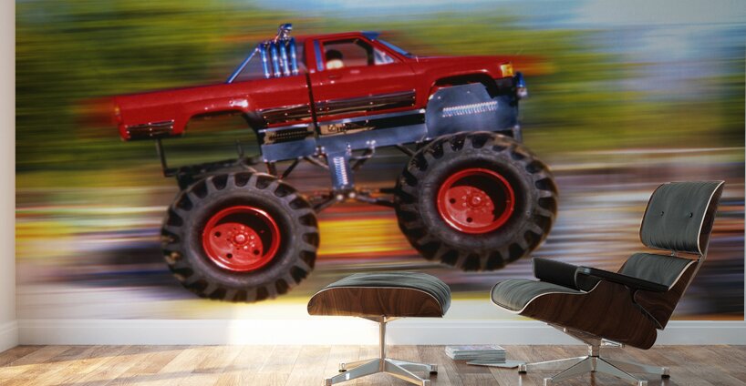BIG WHEELED RED TRUCK JUMPING BLURRED BACKGROUND 184837 Wall Murals