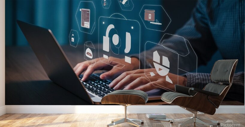 a person using a laptop at a table a stock photo Wall Murals