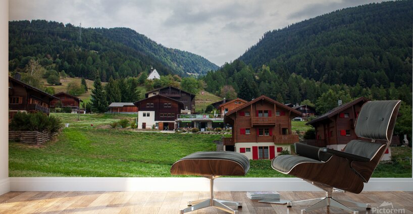 Charming houses dotting the Swiss Alps in Switzerland. Wall Murals