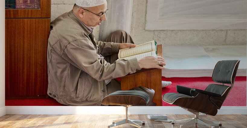Istanbul Turkey. Muslim believer praying and reading Koran in the Fatih Mosque Wall Murals