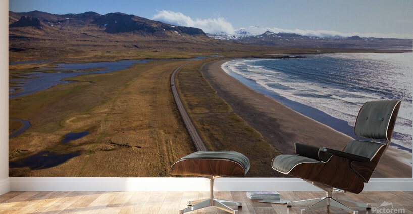 Iceland scenic route Snaefellsnes pensinsula volcano in the background covered in snow empty road with the ocean and waves. Wall Murals