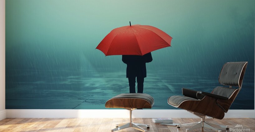 Person under a red umbrella stands alone in heavy rain on a foggy street during a gloomy day Wall Murals