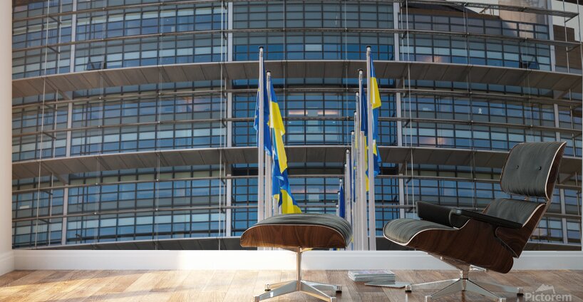 Front view of Ukrainian flag flies next to the Flag of Europe in front of Parliament building Wall Murals