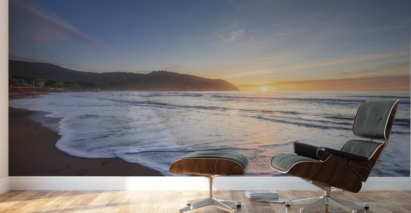 Waves on the Baratti beach at sunset. Tuscany Italy Wall Murals