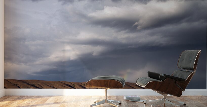 Rainbow with diagonal clouds over morning light on mountains Wall Murals