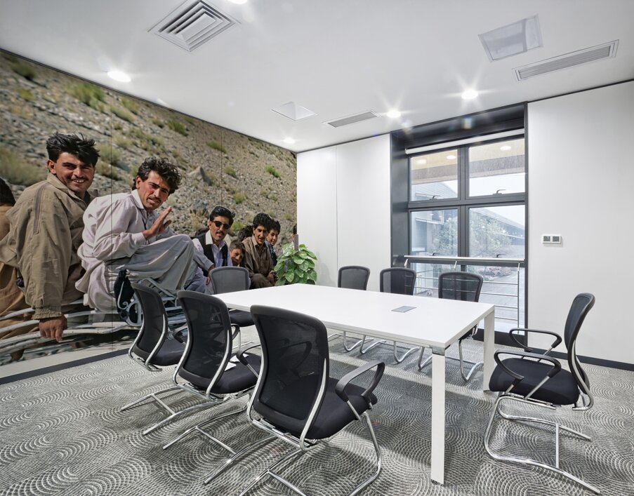 Pakistan. People travelling on the roof of a van Wall Printing