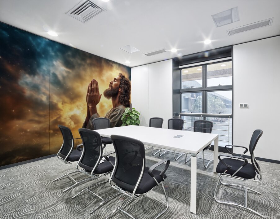 Jesus Christ in prayer with hands clasped in devotion against a dramatic sky backdrop Wall Printing
