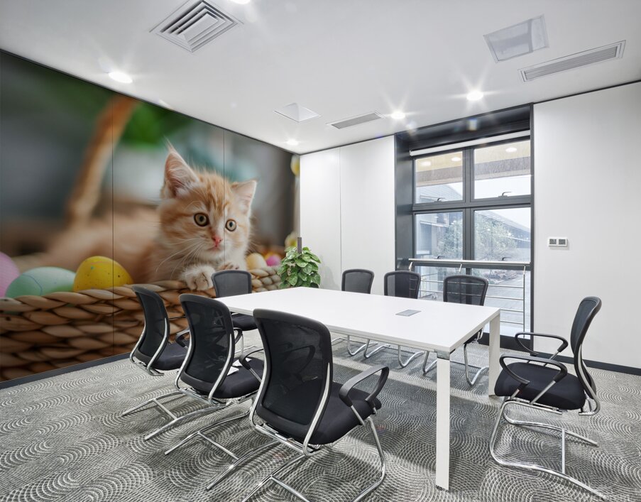 A cute kitten sits amidst Easter eggs in a basket. Wall Printing