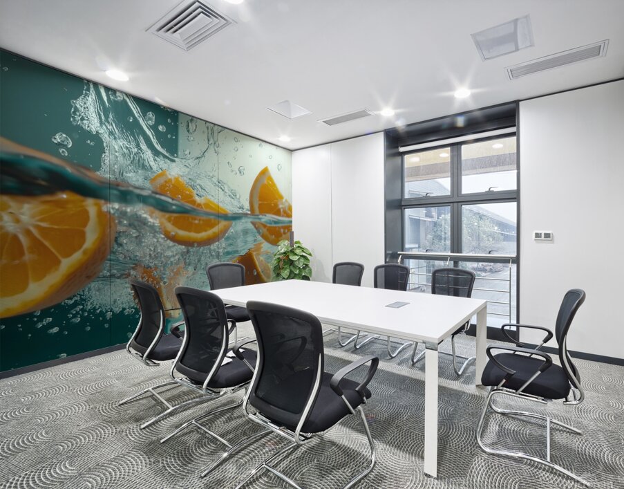 Fresh orange slices drop into clear water sending splashes and bubbles around. The vibrant fruit contrasts beautifully against the transparent liquid creating an enticing visual. Wall Printing