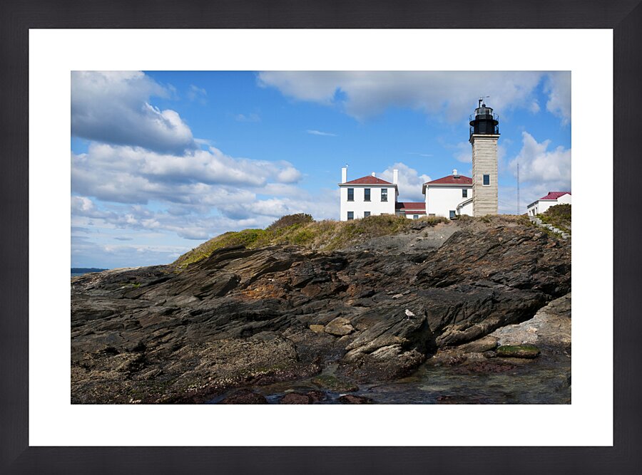 Beavertail Lighthouse Over Dangerous Rocky Shoreline in Rhode Island Picture Frame print