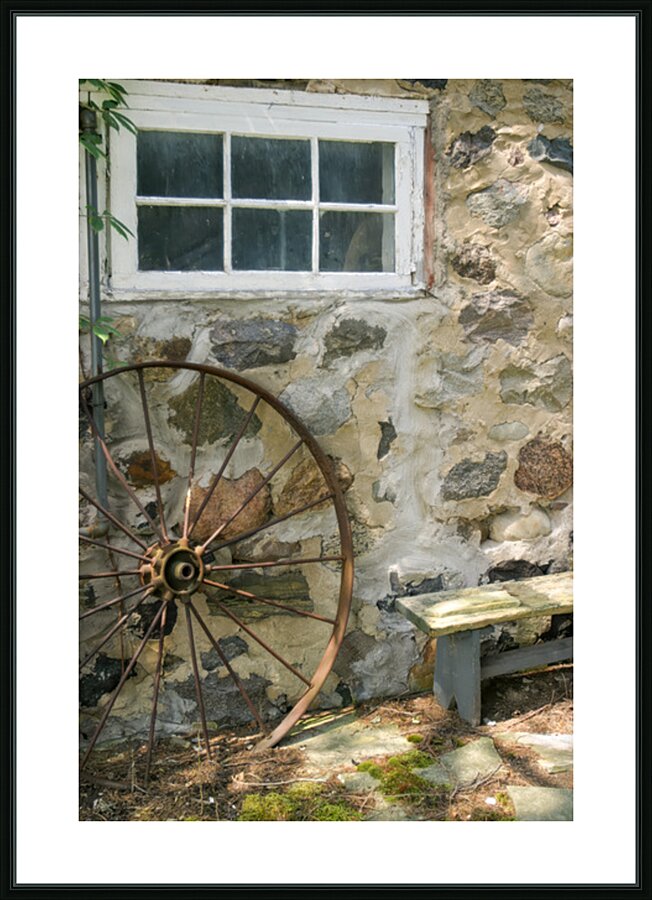 Rusty Wheel and Stone Wall Picture Frame print