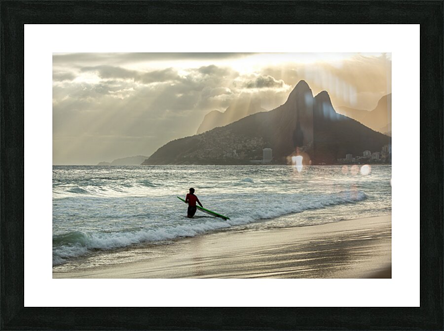 Surfer entering the water during dramatic sunset at Ipanema Beach in Rio de Janeiro  Picture Frame print