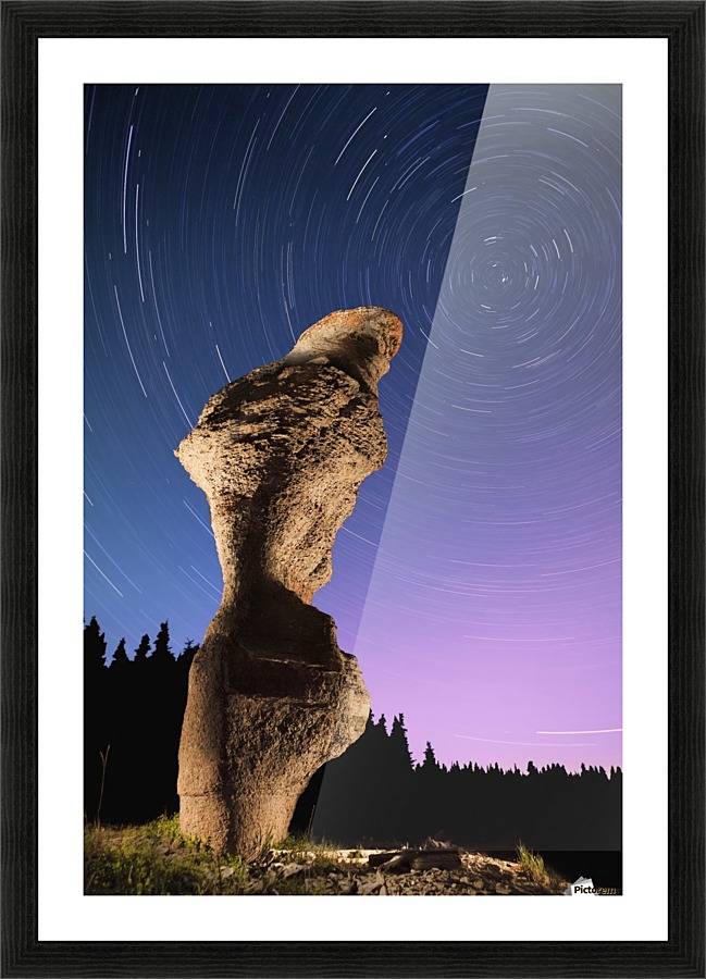 Light painting on monolith and star trails, Anse des Bonnes Femmes at Ile Niapiskau, Mingan Archipelago National Park Reserve of Canada, Cote-Nord, Duplessis region; Quebec, Canada Picture Frame print
