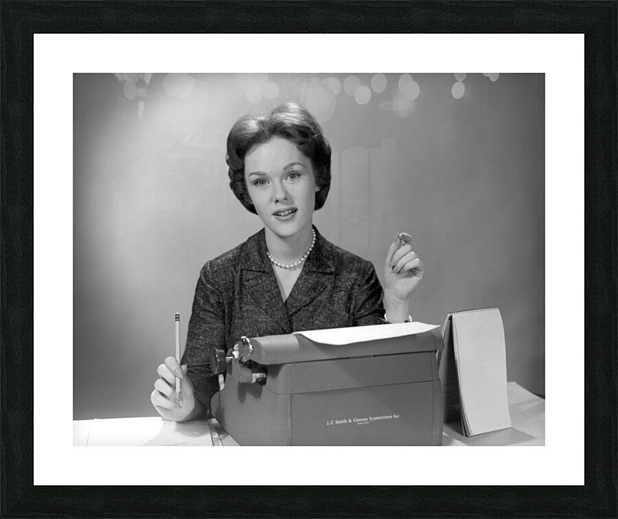 1960s SECRETARY SEATED BEHIND TYPEWRITER WITH PAD 195037 Picture Frame print