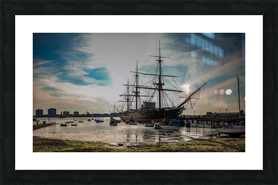 Nelsons Pride: HMS Victory in Portsmouths Sunlit Embrace Picture Frame print