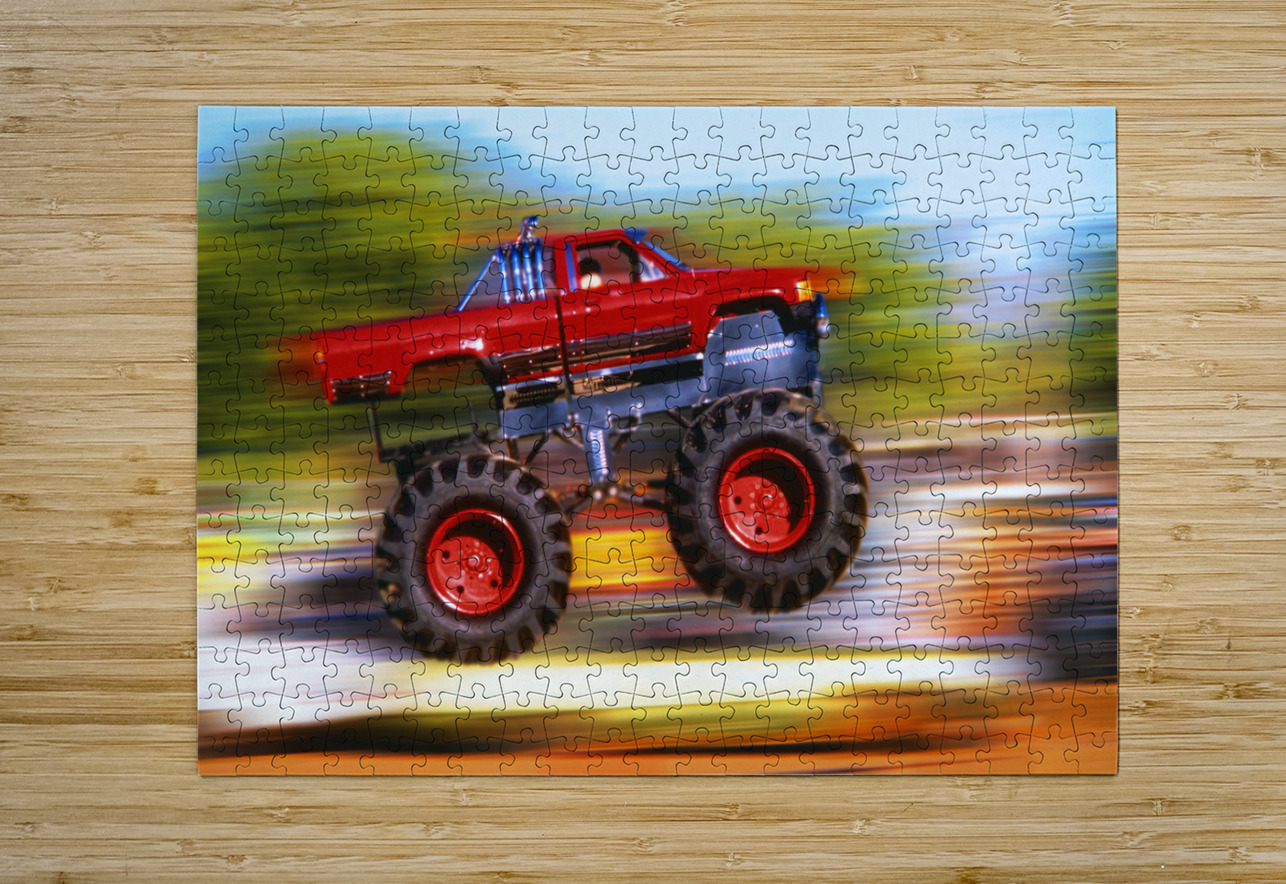 BIG WHEELED RED TRUCK JUMPING BLURRED BACKGROUND 184837 Panoramic Images Puzzle printing