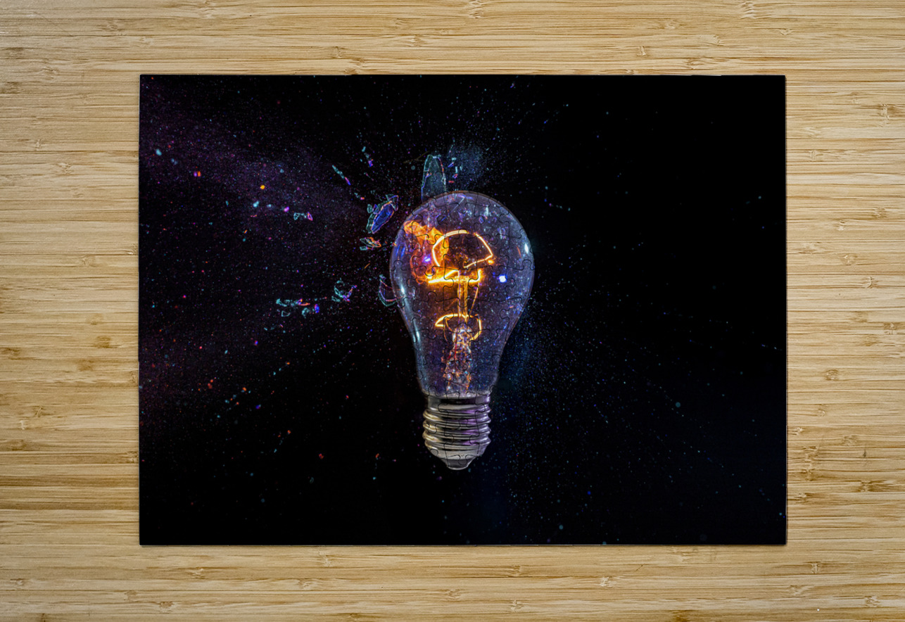 old bulb breaking into fragments on black  Gualtiero Boffi Puzzle printing