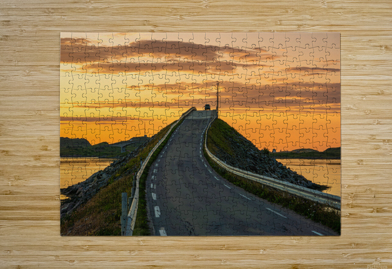 A car on the Fredvang bridges in Lofoten Norway with a beautiful sunset over the sea.  John Nilsson Puzzle printing