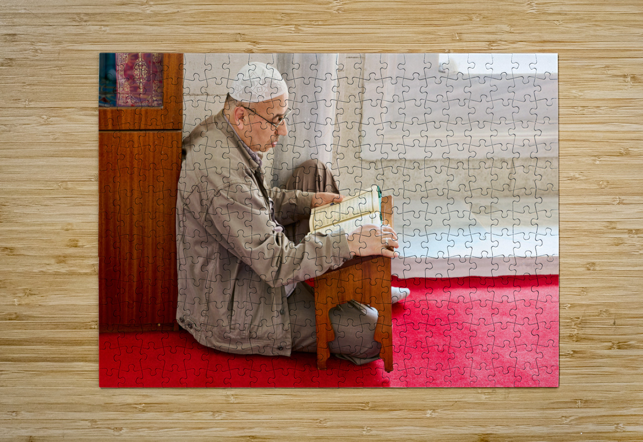 Istanbul Turkey. Muslim believer praying and reading Koran in the Fatih Mosque Marco Brivio Puzzle printing