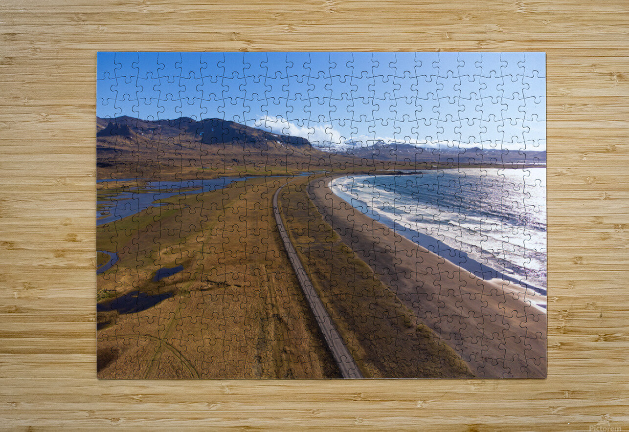 Iceland scenic route Snaefellsnes pensinsula volcano in the background covered in snow empty road with the ocean and waves. John Nilsson Puzzle printing
