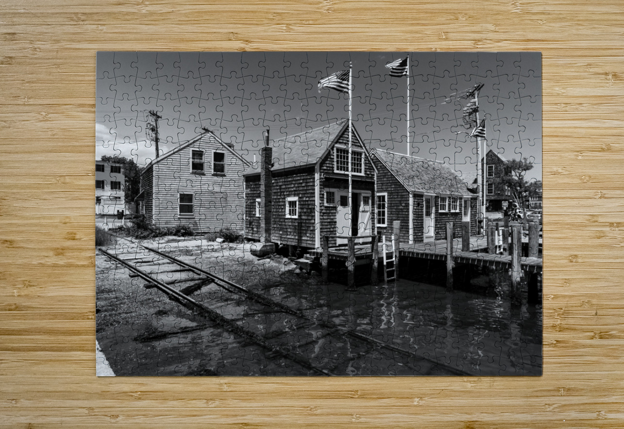 Black and white shot of historic harbour buildings and boat ramp on Cape Cod in New England  caladoart Puzzle printing