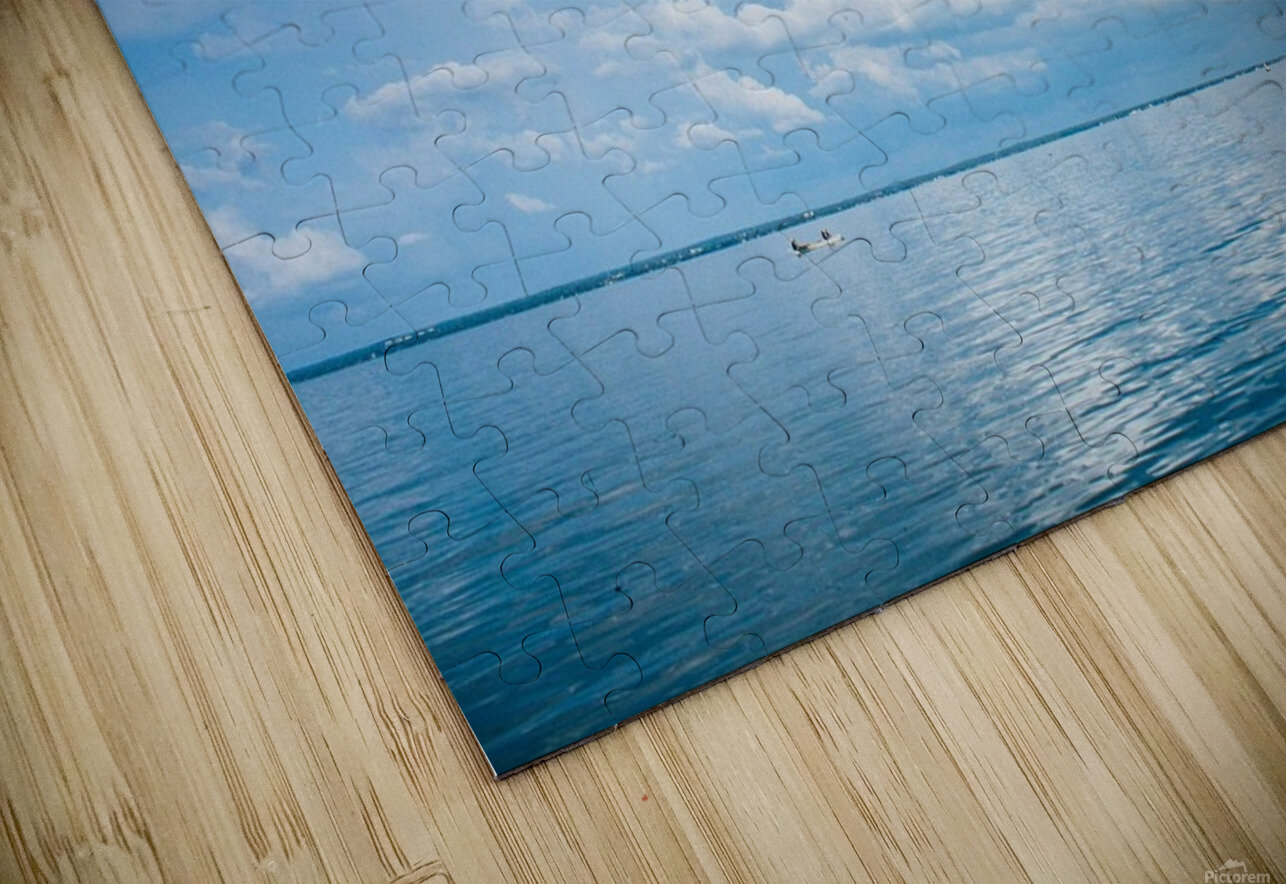 Seascape with bright blue cloudy sky. CameraOldStyle Puzzle