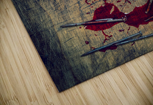 hammer and bloody nails on a wooden Gualtiero Boffi puzzle