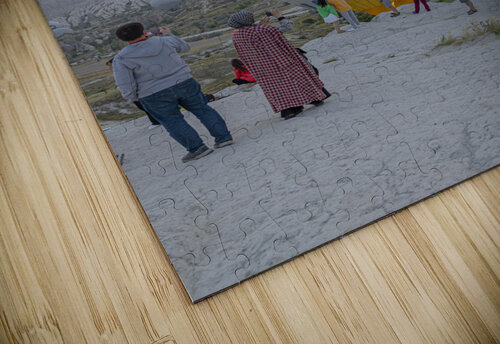 hot air balloon flies near the tourists over the hills of goreme Gualtiero Boffi puzzle