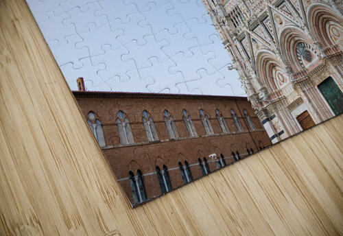 Siena cathedral in Italy. White marbles with blue sky famous la Paolo Modena puzzle