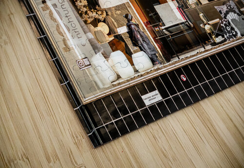 Street photo of reflections in a stylish furniture shop window in the city caladoart puzzle