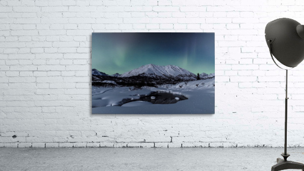 Aurora Borealis (Northern Lights) dance above Idaho Peak and the Little Susitna River at Hatcher Pass in winter, South-central Alaska; Alaska, United States of America by PacificStock