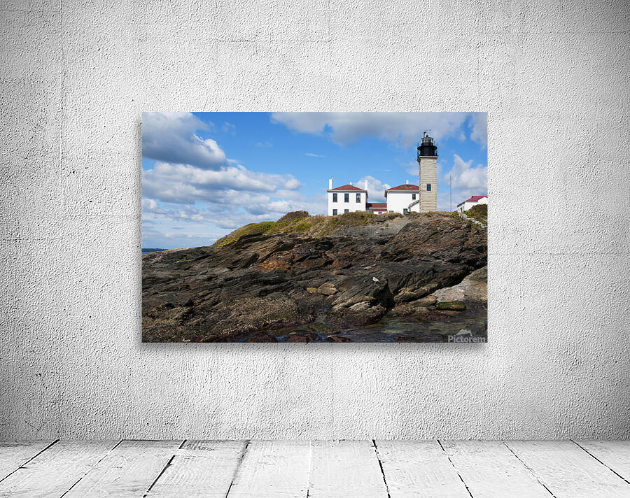 Beavertail Lighthouse Over Dangerous Rocky Shoreline in Rhode Island Wall Preview