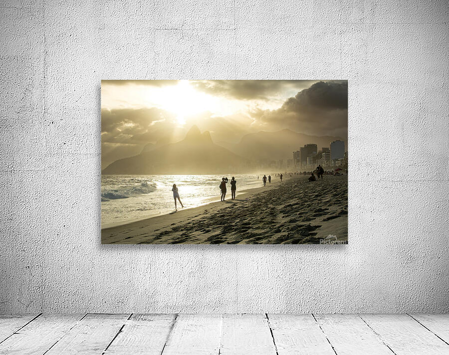 People enjoying dramatic sunset at Ipanema Beach in Rio de Janeiro  Wall Preview