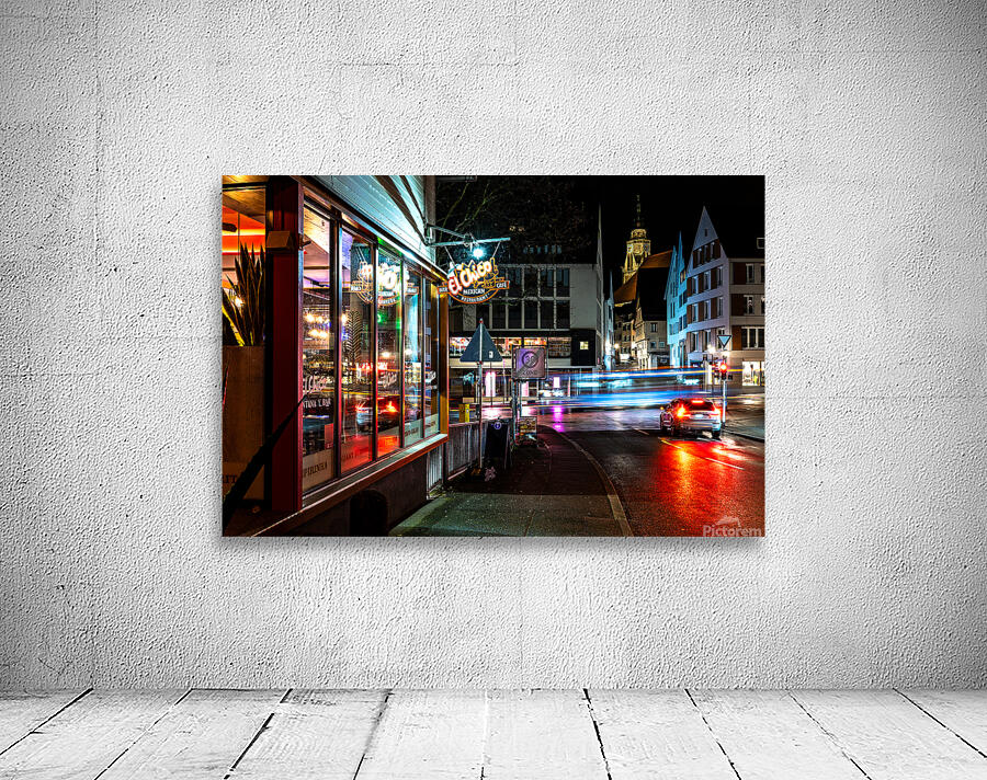Night shot of restaurant and blurred car lights on a main street in Tübingen Wall Preview