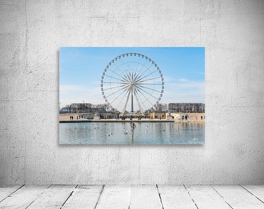 Paris ferris-wheel against blue sky from the Tuileries park Wall Preview