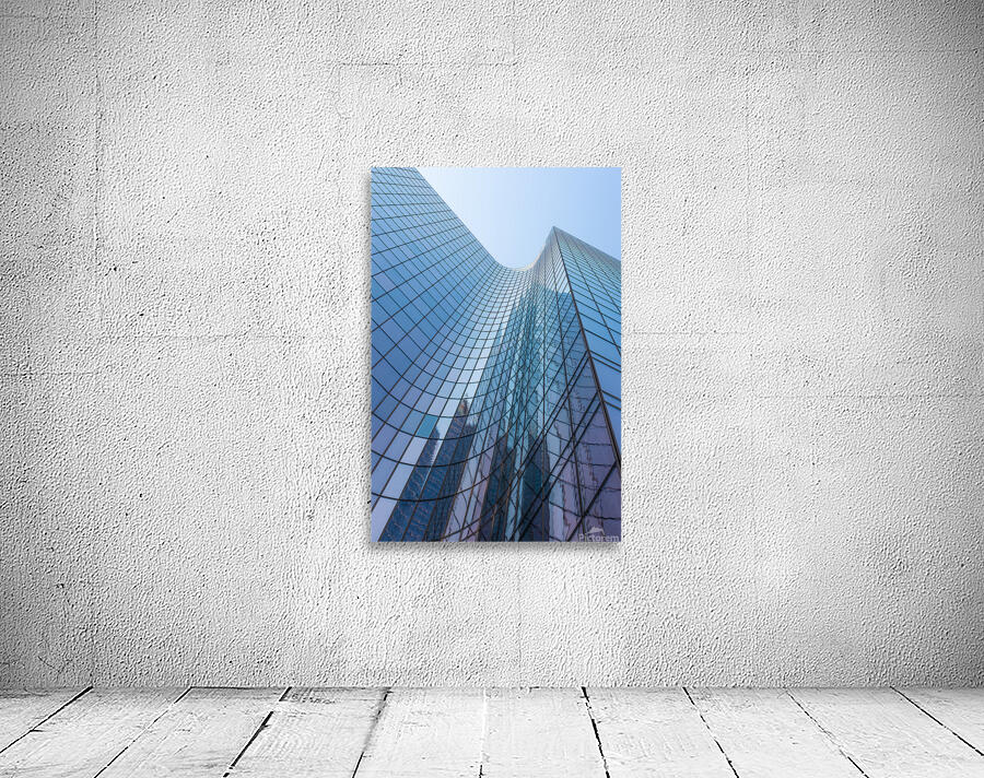 Blue curved glass skyscraper facade against sky Wall Preview