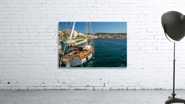 Luxurious sailing yacht in the harbour of Mali on the island of Losinj in the Adriatic Sea Croatia by caladoart
