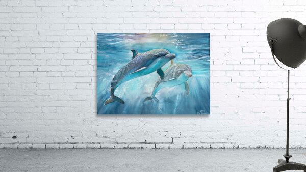 Dolphins in the ocean by Hubert ABITBOL