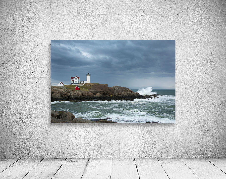 Sunlight Breaking Through Storm Clouds Over Nubble Light in Maine Wall Preview