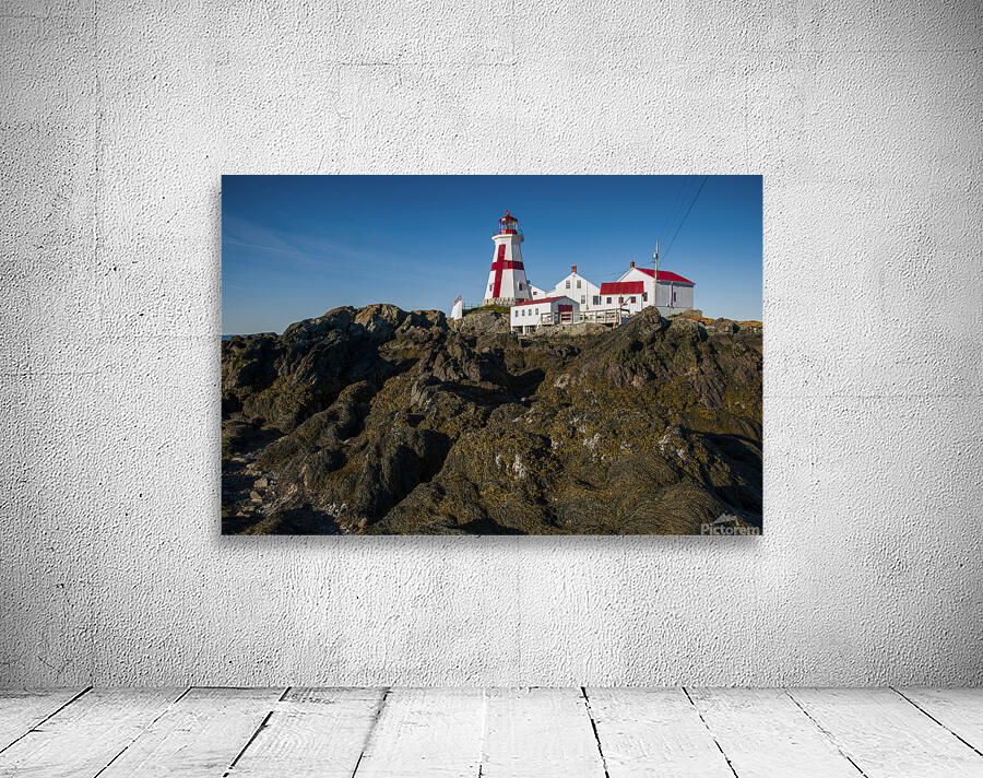 Low Tide Displays Rocky Shore at Head Harbor Lighthouse on Campobello Island in Canada by Allan Wood