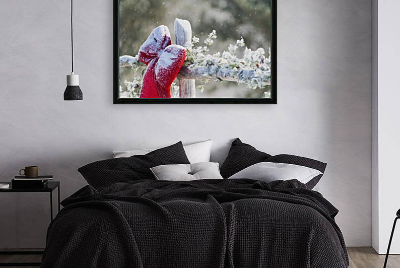 Fresh snow on holiday bow and decorations on fence post, Christmas season; Minnesota, United States of America by PacificStock