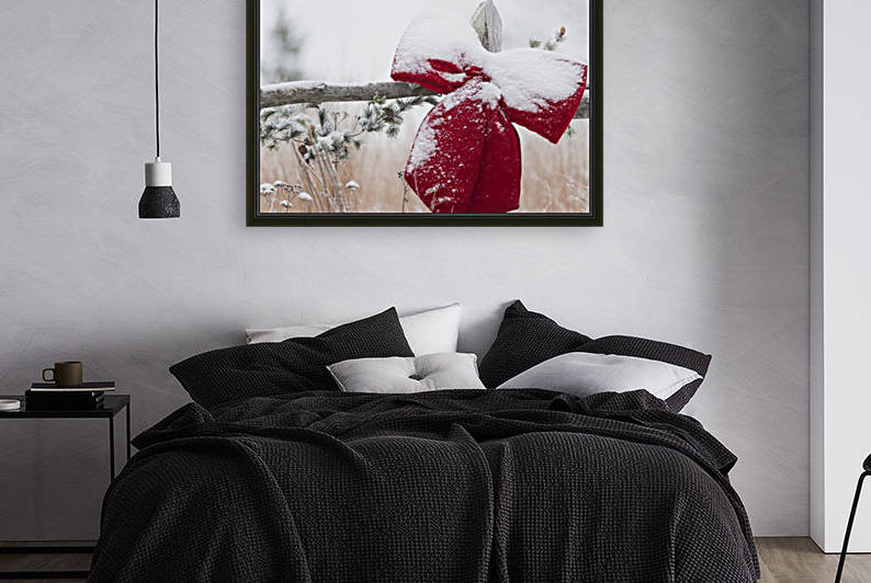 Fresh snow on holiday bow and decorations on fence post, Christmas season; Minnesota, United States of America by PacificStock