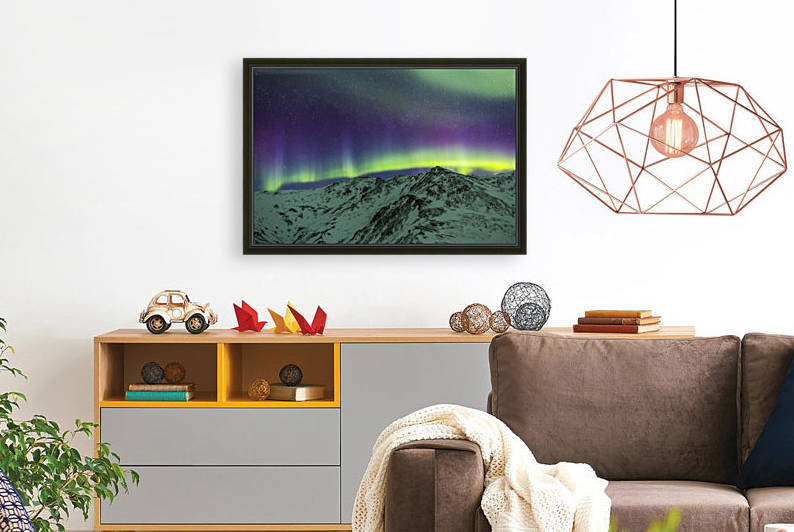 Aurora borealis over mountains within Denali National Park on a very cold winter night.  The Andromeda Galaxy is visible to the left; Alaska, United States of America by PacificStock