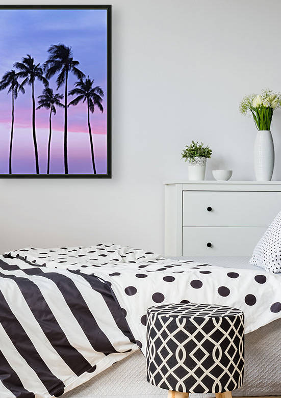 Five coconut palm trees in line with cotton candy sunset behind; Honolulu, Oahu, Hawaii, United States of America by PacificStock