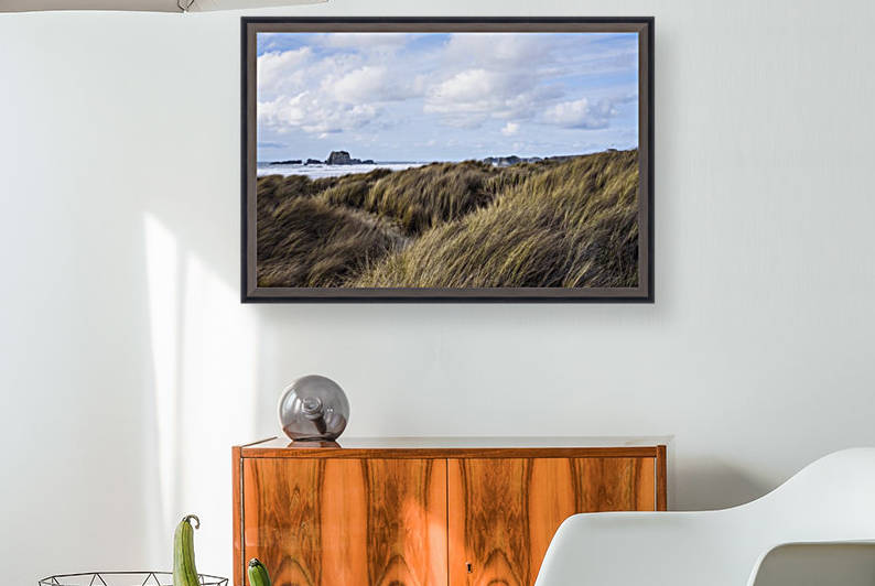 Grass and clouds frame a scene along the coast; Bandon, Oregon, United States of America by PacificStock