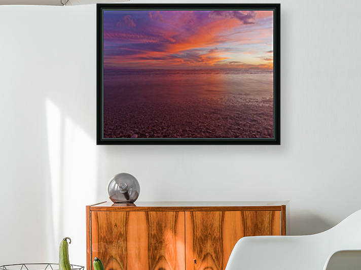 A dramatic beachscape with sunset colours of the sky and ocean taken in long exposure; Honolulu, Oahu, Hawaii, United States of America by PacificStock