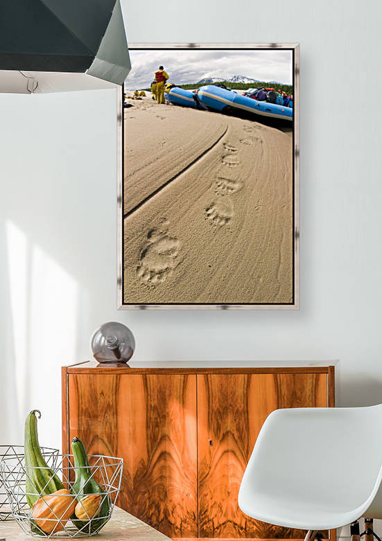 Brown Bear Tracks In The Sand In The Foreground As Rafters Bring Raft To Shore On The Lower Copper River Alaska Southcentral Summer by PacificStock